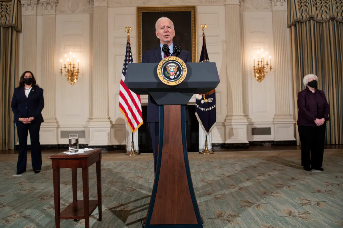 President Joe Biden speaks while flanked by Vice President Kamala Harris, left, and Treasury Secretary Janet Yellen, in the White House in Washington on Feb. 5, 2021. (Brendan Smialowski/AFP via Getty Images)