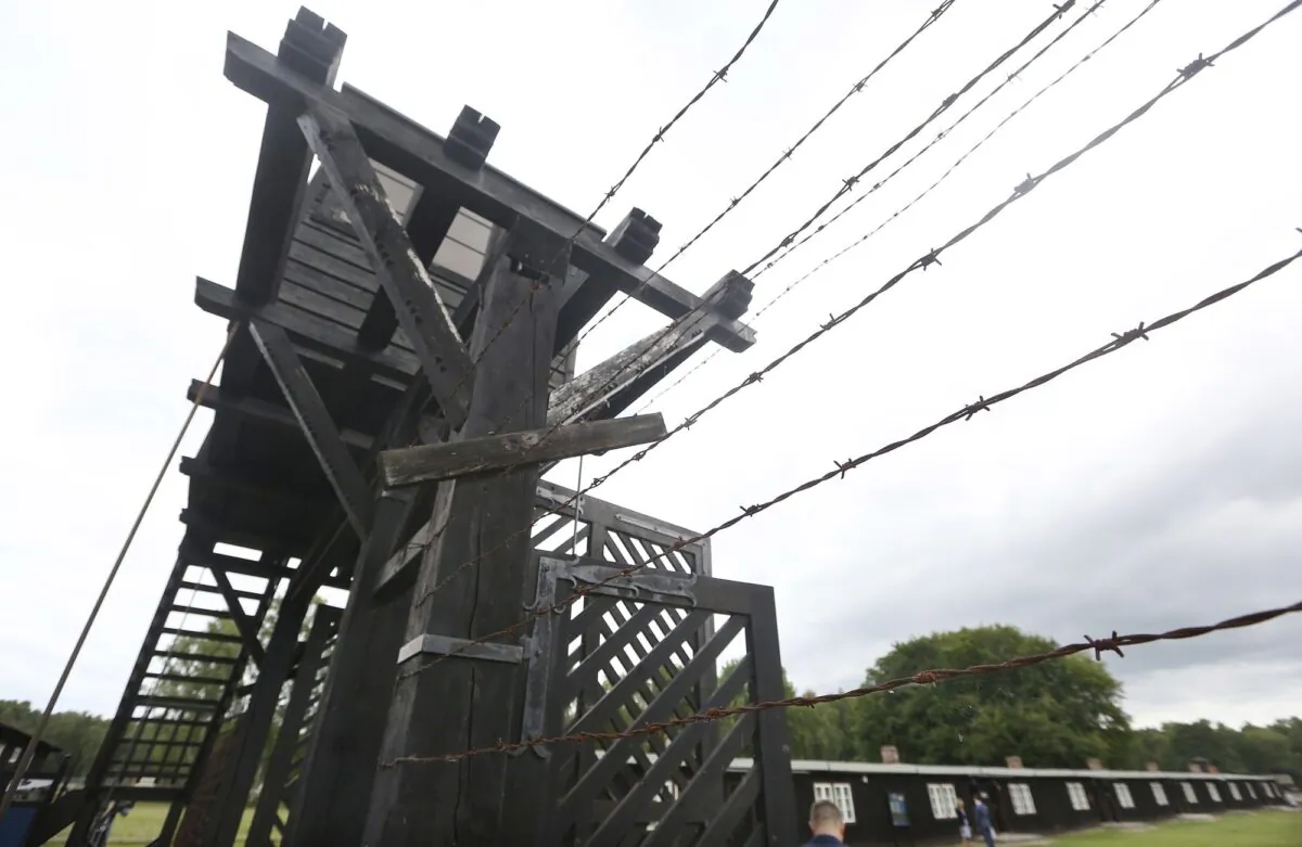 The wooden main gate leads into the former Nazi German Stutthof concentration camp in Sztutowo, Poland, on July 18, 2017. (Czarek Sokolowski/AP Photo)