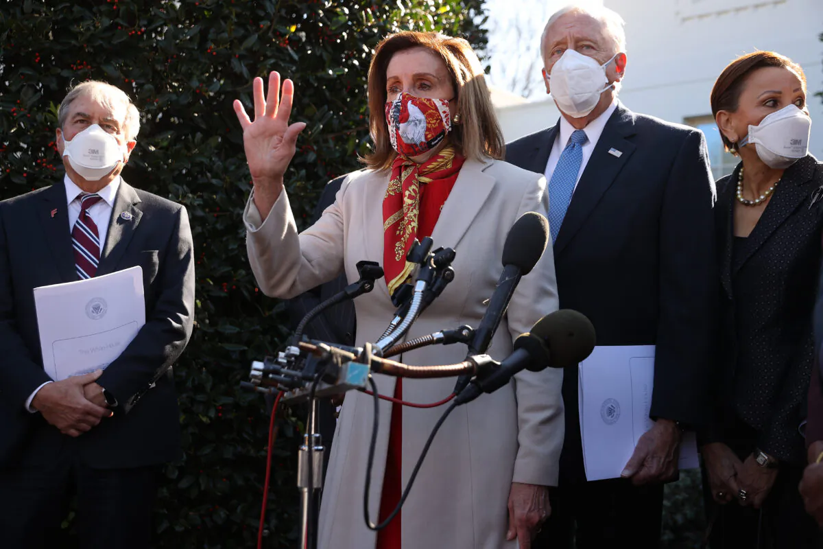 Speaker of the House Nancy Pelosi (D-Calif.) (C) talks to reporters outside the West Wing in Washington on Feb. 5, 2021. (Chip Somodevilla/Getty Images)