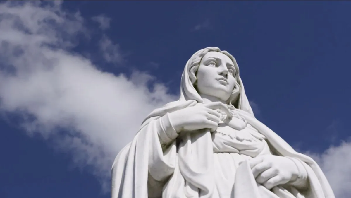 A statue of the Virgin Mary with clouds behinds (Family Theater Productions/ArtAffects Entertainment)