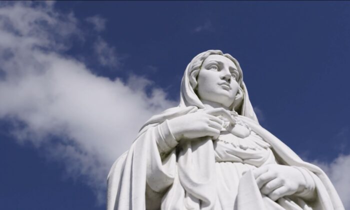 A statue of the Virgin Mary with clouds behinds (Family Theater Productions/ArtAffects Entertainment)