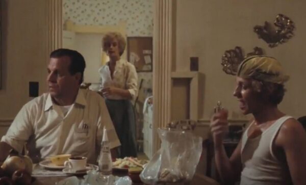 family at supper with mother in kitchen