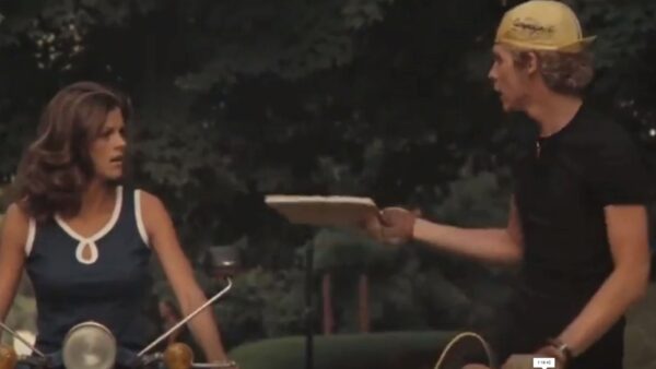 teen gives notebook to young lady