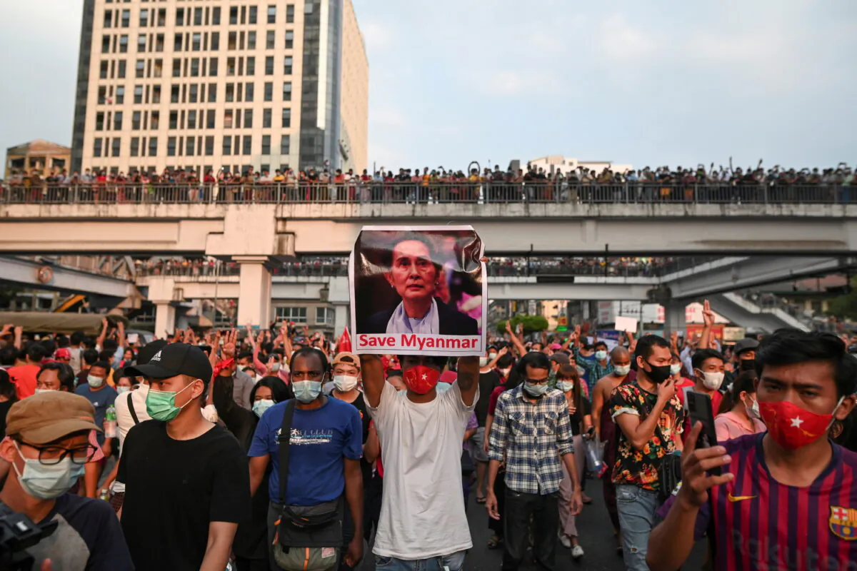 Demonstrators protest against the military coup and demand the release of elected leader Aung San Suu Kyi, in Yangon, Burma, on Feb. 6, 2021. (Stringer/ Reuters)