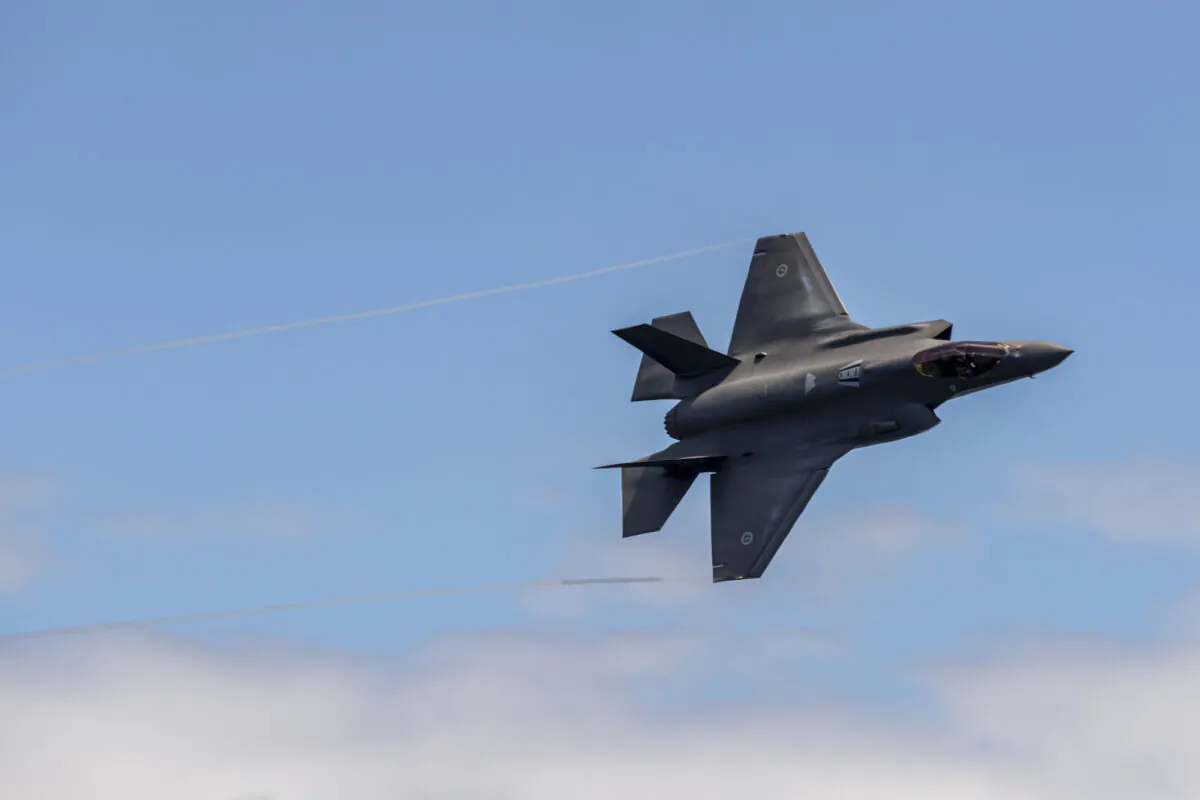 Royal Australian Air Force F-35A Lightning II aircraft conduct a flypast of HMAS Sydney during an air warfare serial off the coast of New South Wales, Australia, on Dec. 11, 2020. (LSIS Leo Baumgartner/ADF)