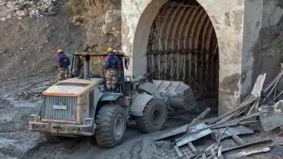 Indo Tibetan Border Police personnel are using machinery to clear mud as they try to rescue more than three dozen power plant workers trapped in a tunnel in the Tapovan area of the northern state of Uttarakhand, India, on Feb. 8, 2021. (Indo Tibetan Border Police via AP)