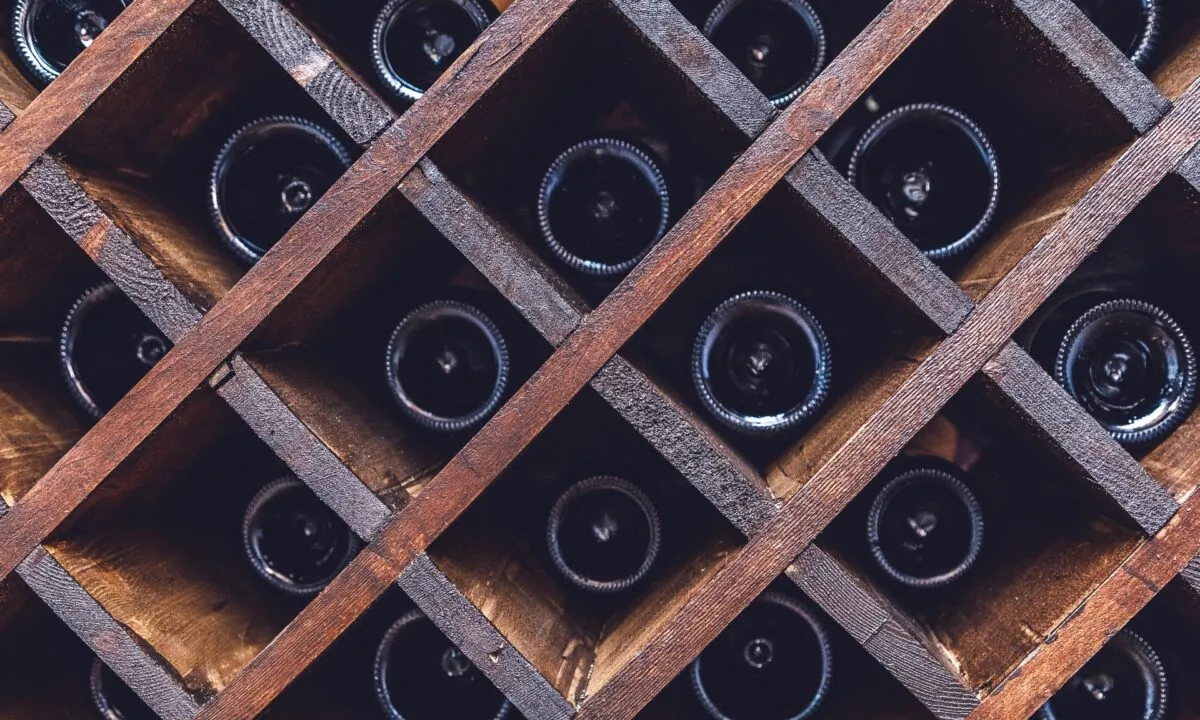 Here's the easy way: Buy a few bottles of young but cellar-worthy wine and tuck them away for 10 years or more. (Mila Larson/Shutterstock)