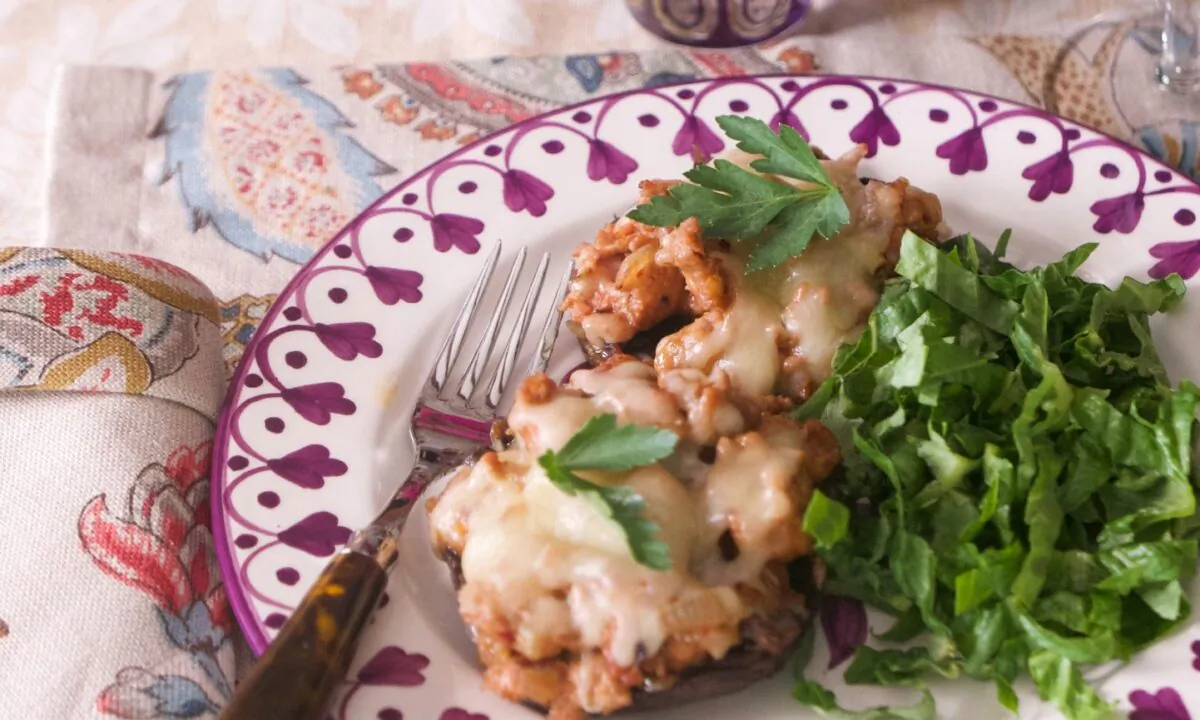 These sausage and vegetable-stuffed portobellos make an easy meal with a simple green salad. (Victoria de la Maza)