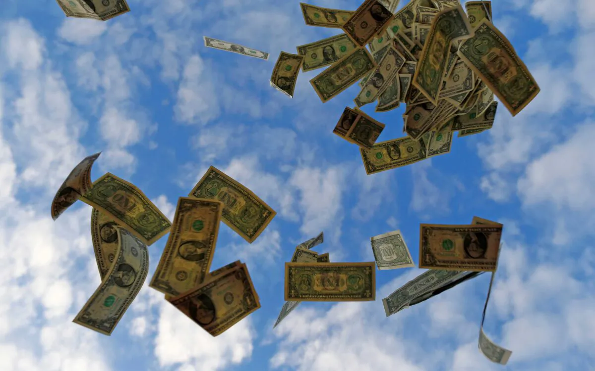 U.S. dollar bills blow near the Andalusian capital of Seville in this photo illustration taken on Nov. 16, 2014. (Marcelo Del Pozo/Reuters)