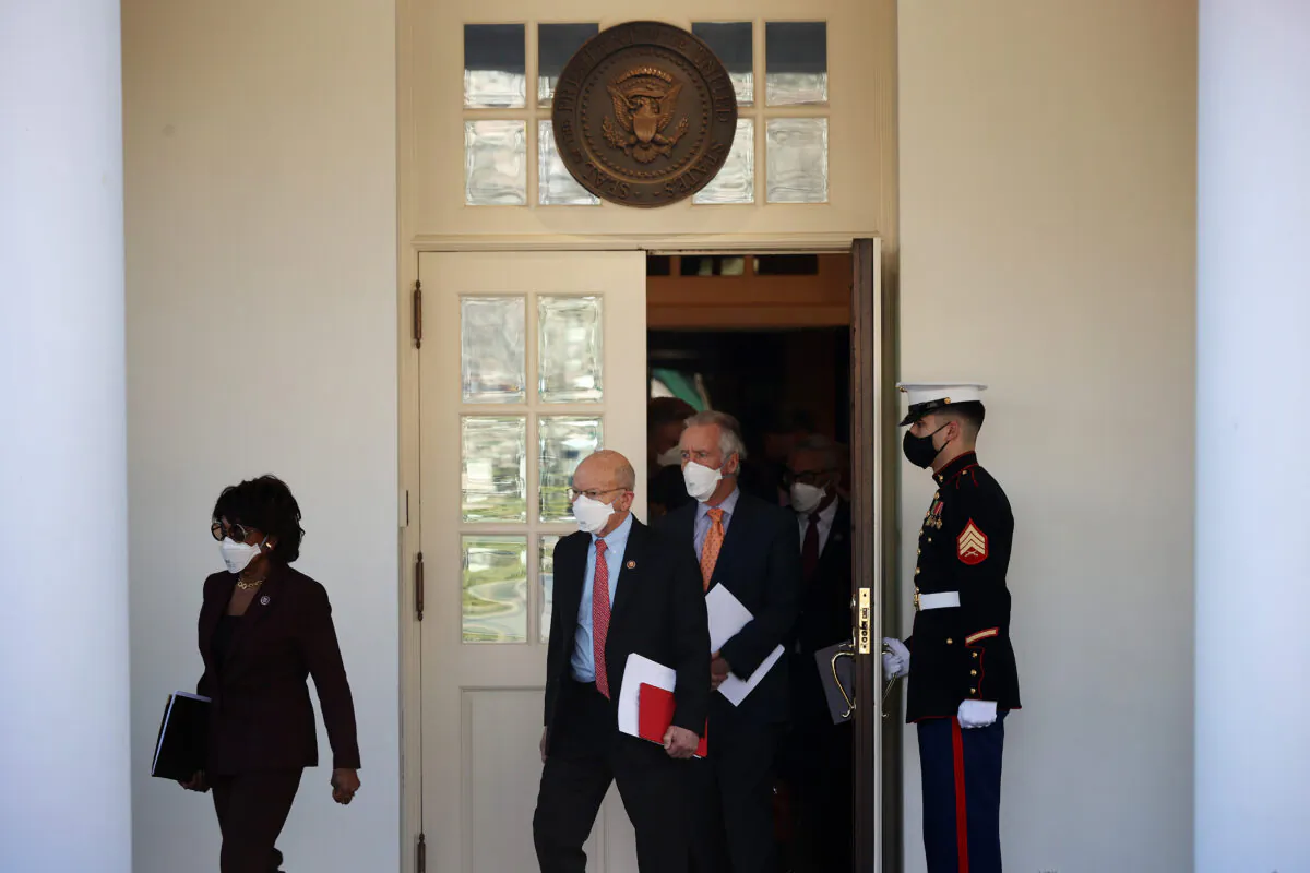 (L-R) House Financial Services Committee Chair Maxine Waters (D-CA), House Transportation Committee Chairman Peter DeFazio (D-WA), House Ways and Means Committee Chairman Richard Neal (D-MA) and other House Democratic leaders walk out of the West Wing of the White House after meeting with President Joe Biden to discuss COVID-19 relief legislation on Feb. 5, 2021. (Chip Somodevilla/Getty Images)