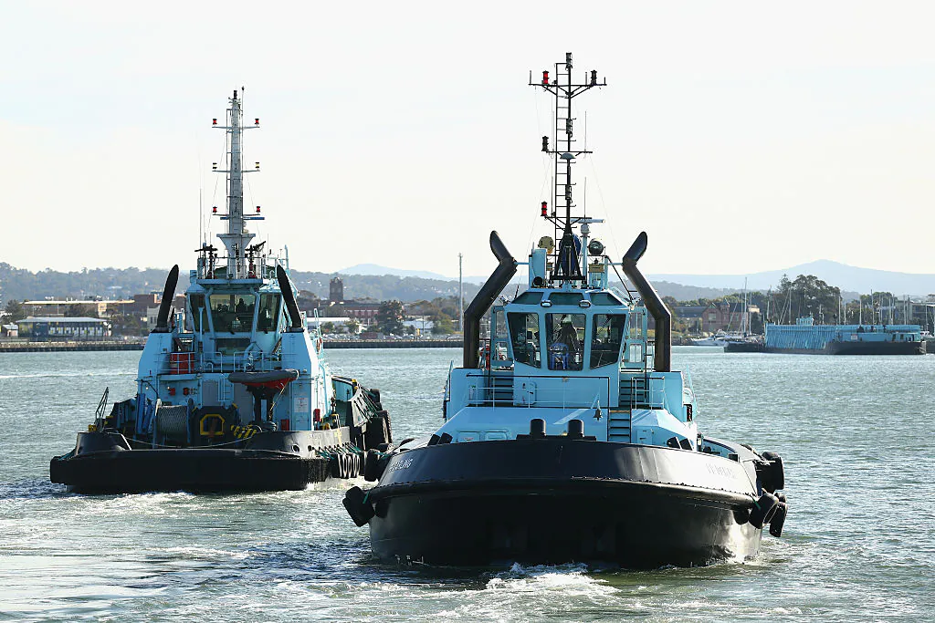 Tugboats return to their base after assisting the 'Toro Orient' through Newcastle Port on July 30, 2015 in Newcastle, Australia. (Cameron Spencer/Getty Images)