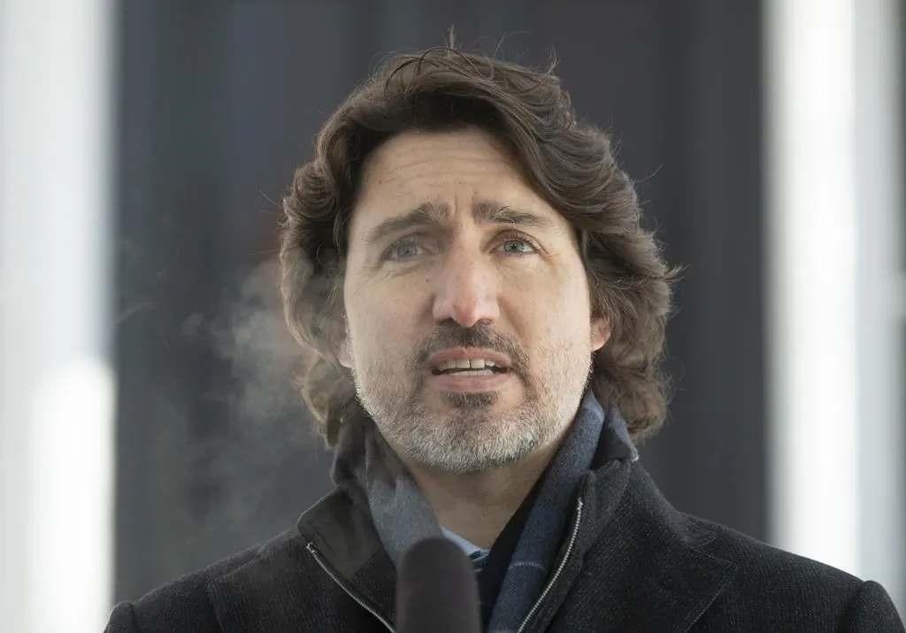 Prime Minister Justin Trudeau speaks outside Rideau Cottage in Ottawa, on Feb. 9, 2021. (Adrian Wyld/The Canadian Press)