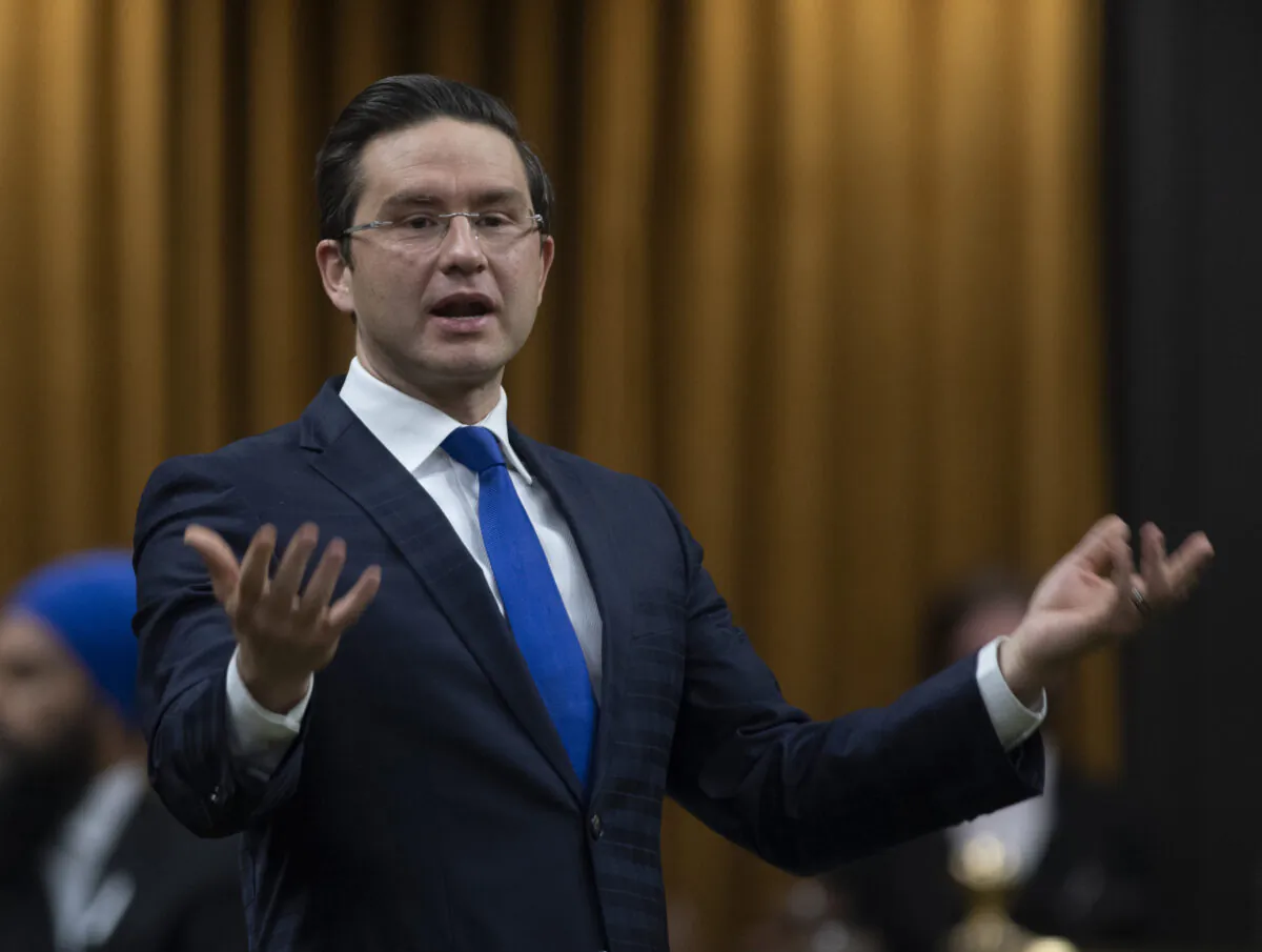 Conservative MP Pierre Poilievre rises during Question Period in the House of Commons in Ottawa, Canada, on Dec. 3, 2020. (Adrian Wyld/The Canadian Press)