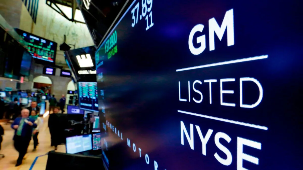 The logo for General Motors appears above a trading post on the floor of the New York Stock Exchange in New York City on April 23, 2018. (Richard Drew/AP Photo)