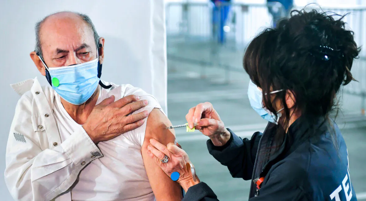A man receives a COVID-19 vaccine at California State Polytechnic University-Pomona in Pomona, Calif., on Feb. 5, 2021. (Frederic J. Brown/AFP via Getty Images)