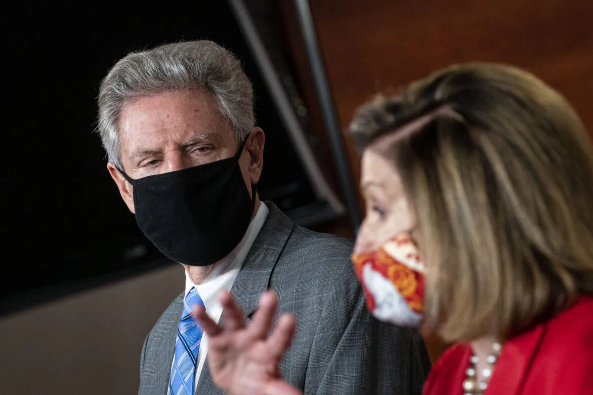 House Energy and Commerce Chairman Frank Pallone (D-N.J.) listens during a press conference as House Speaker Nancy Pelosi (D-Calif.) speaks, in Washington on Nov. 6, 2020. (Al Drago/Getty Images)
