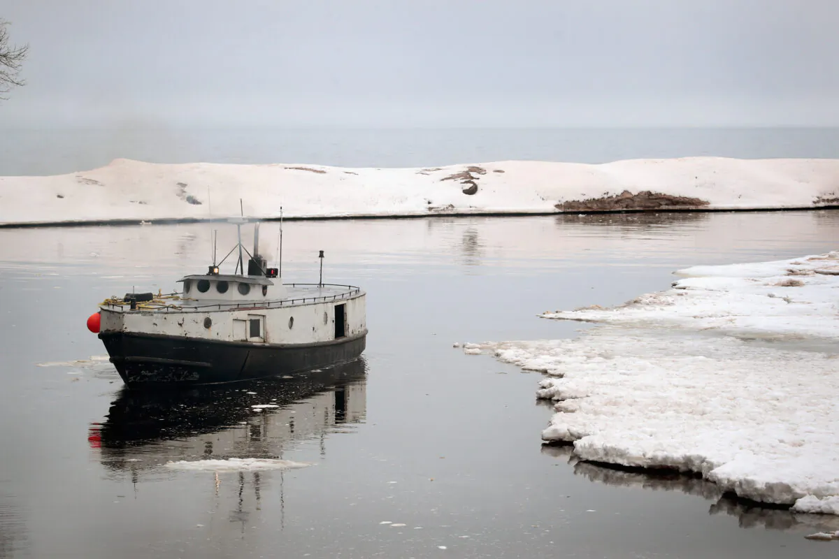 A fishing boat heads out toward Lake Superior from Black River Harbor near Ironwood, Mich., on March 27, 2017. (Scott Olson/Getty Images)