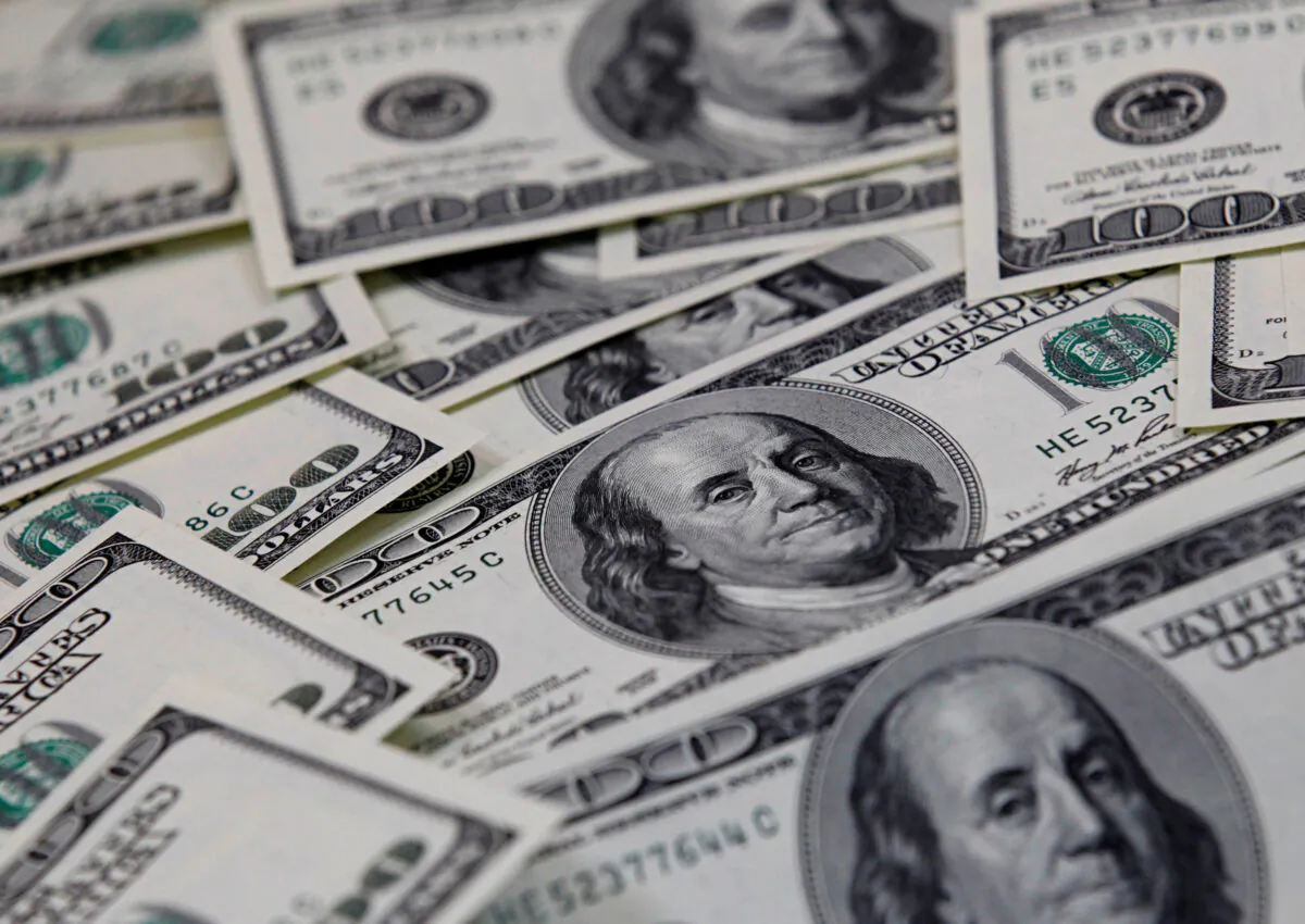 One hundred dollar notes in a file photo. (Lee Jae-won/Reuters)