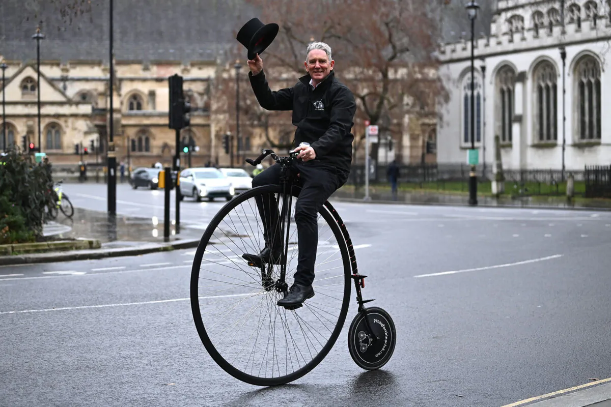 A man rides a penny-farthing bicycle in central London on Jan. 20, 2021. (Daniel Leal-Olivas/AFP via Getty Images)