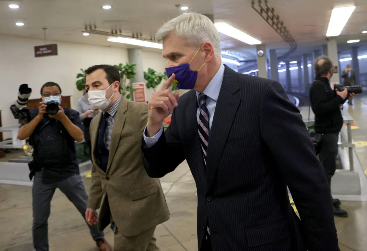 Sen. Bill Cassidy (R-La.) returns after a dinner break on the second day of former President Donald Trump's second impeachment trial in Washington on Feb. 10, 2021. (Win McNamee/Getty Images)