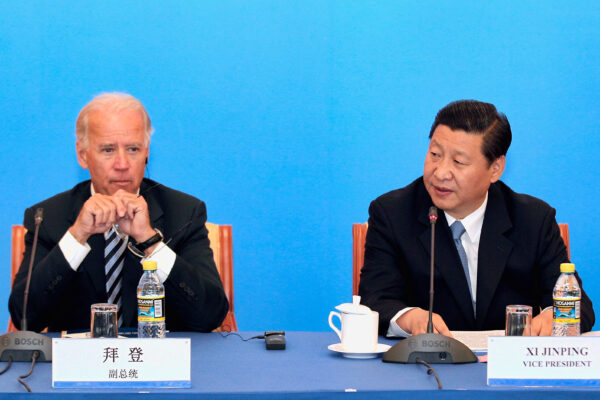 Then Chinese Vice Chair Xi Jinping (R) speaks during talks with then U.S. Vice President Joe Biden