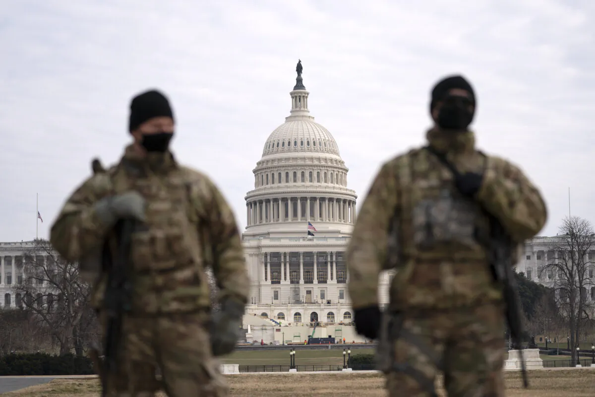 Members of the National Guard patrol the area outside of the U.S. Capitol during the impeachment trial of former President Donald Trump at the Capitol in Washington on Feb. 10, 2021. (Jose Luis Magana/AP Photo)