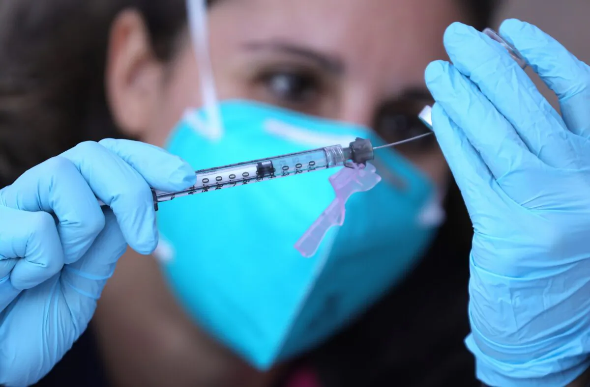 A registered nurse prepares a COVID-19 vaccine in Los Angeles on Feb. 10, 2021. (Mario Tama/Getty Images)