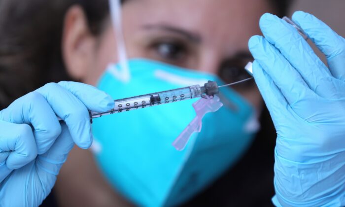 A registered nurse prepares a COVID-19 vaccine in Los Angeles, on Feb. 10, 2021. (Mario Tama/Getty Images)