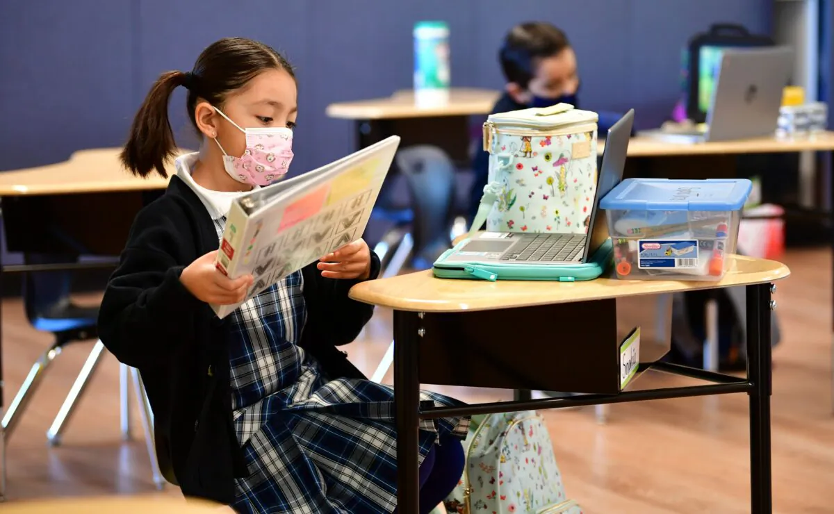 First-grade students prepare for class at St. Joseph Catholic School in La Puente, Calif., on Nov. 16, 2020. (Frederic J. Brown/AFP via Getty Images)