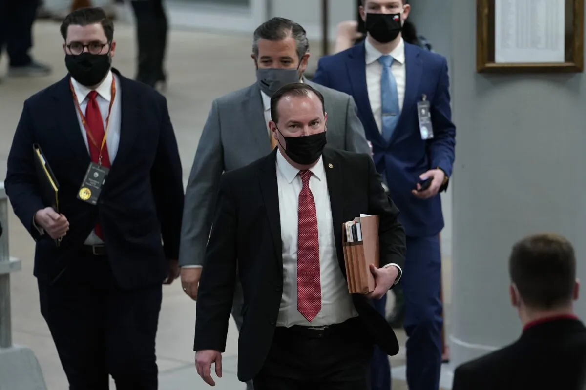 Sen. Mike Lee (R-Utah) followed by Sen. Ted Cruz (R-Texas) walk on Capitol Hill in Washington on Feb. 10, 2021. (Susan Walsh/AP Photo)