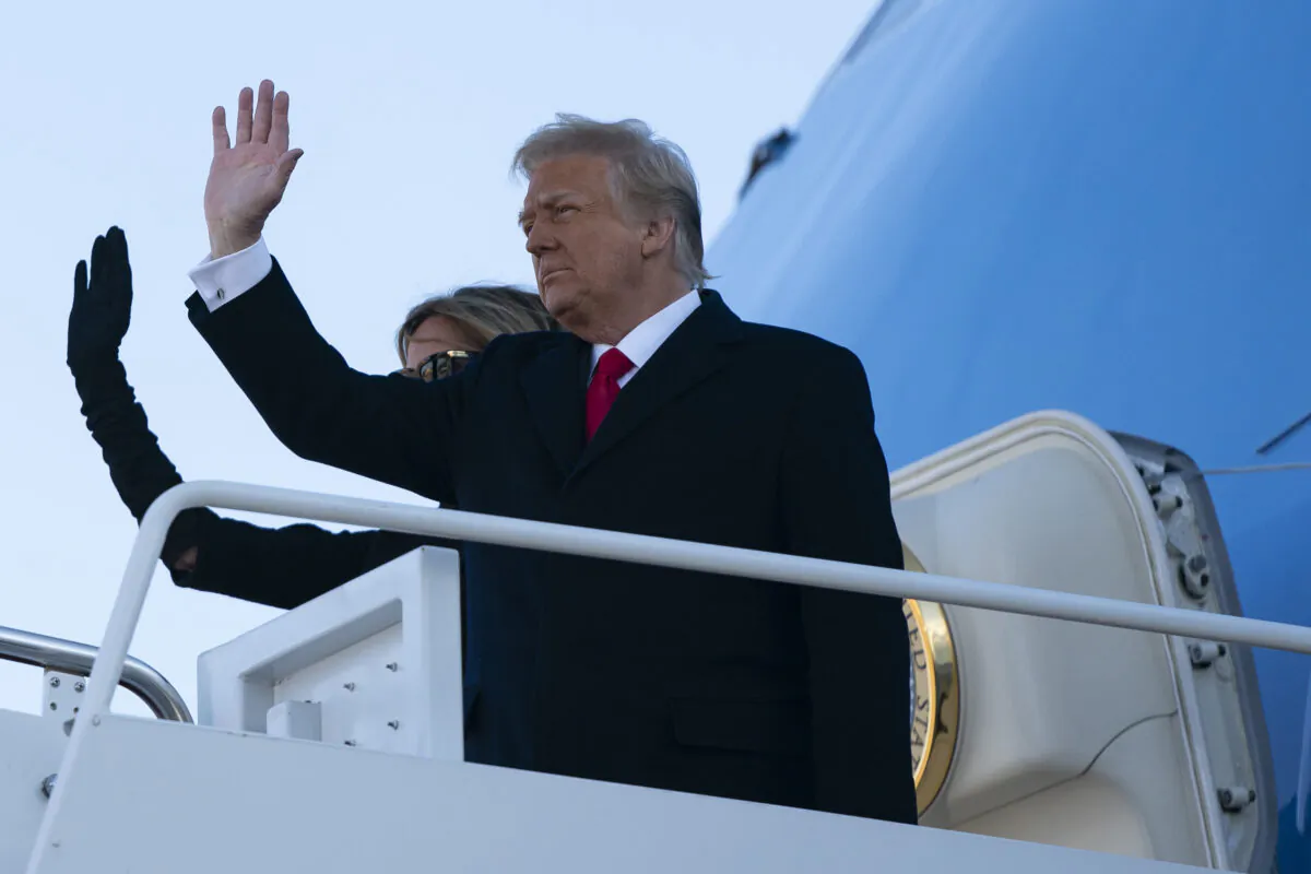 President Donald Trump and First Lady Melania Trump step into Air Force One at Joint Base Andrews in Maryland on Jan. 20, 2021. (Alex Edelman/AFP via Getty Images)