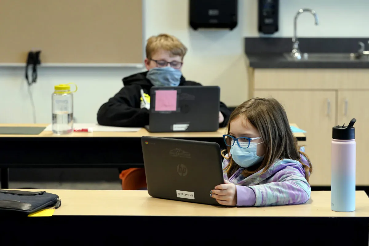 Students wear masks as they work in a fourth-grade classroom, at Elk Ridge Elementary School in Buckley, Wash., on Feb. 2, 2021. (Ted S. Warren/AP Photo)