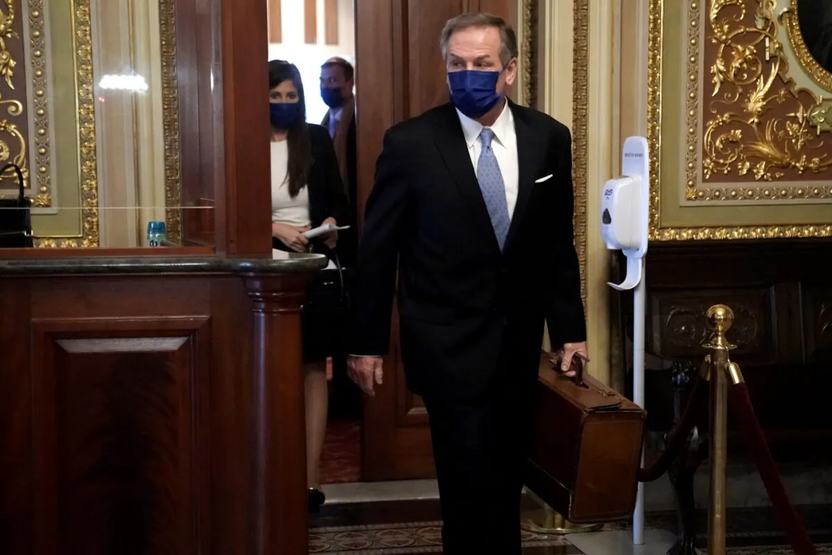 Michael van der Veen, attorney for former President Donald Trump, heads to the Senate Chamber before the fifth day of the Senate Impeachment trials for former President Donald Trump on Capitol Hill in Washington, on Feb. 13, 2021. (Greg Nash/Getty Images)