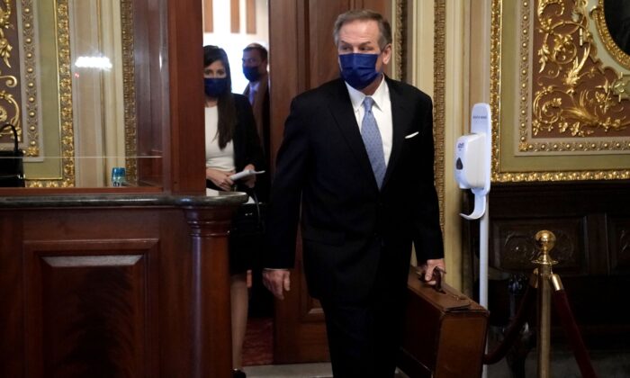Michael van der Veen, attorney for former President Donald Trump, heads to the Senate Chamber before the fifth day of the Senate Impeachment trials for former President Donald Trump on Capitol Hill in Washington, on Feb. 13, 2021. (Greg Nash/Getty Images)