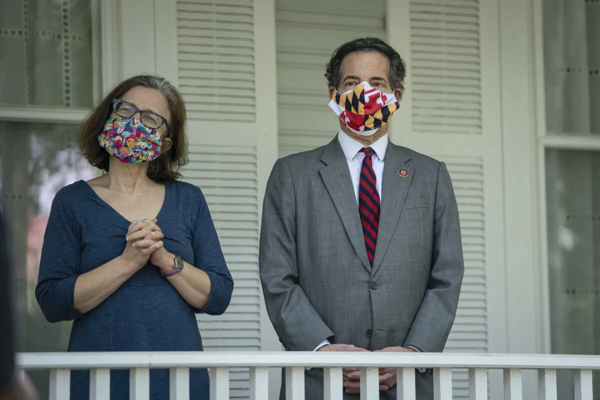 Sarah Bloom Raskin and U.S. Rep. Jamie Raskin (D-Md.) in the front yard of their home in Takoma Park, Md. on May 4, 2020. (Drew Angerer/Getty Images)