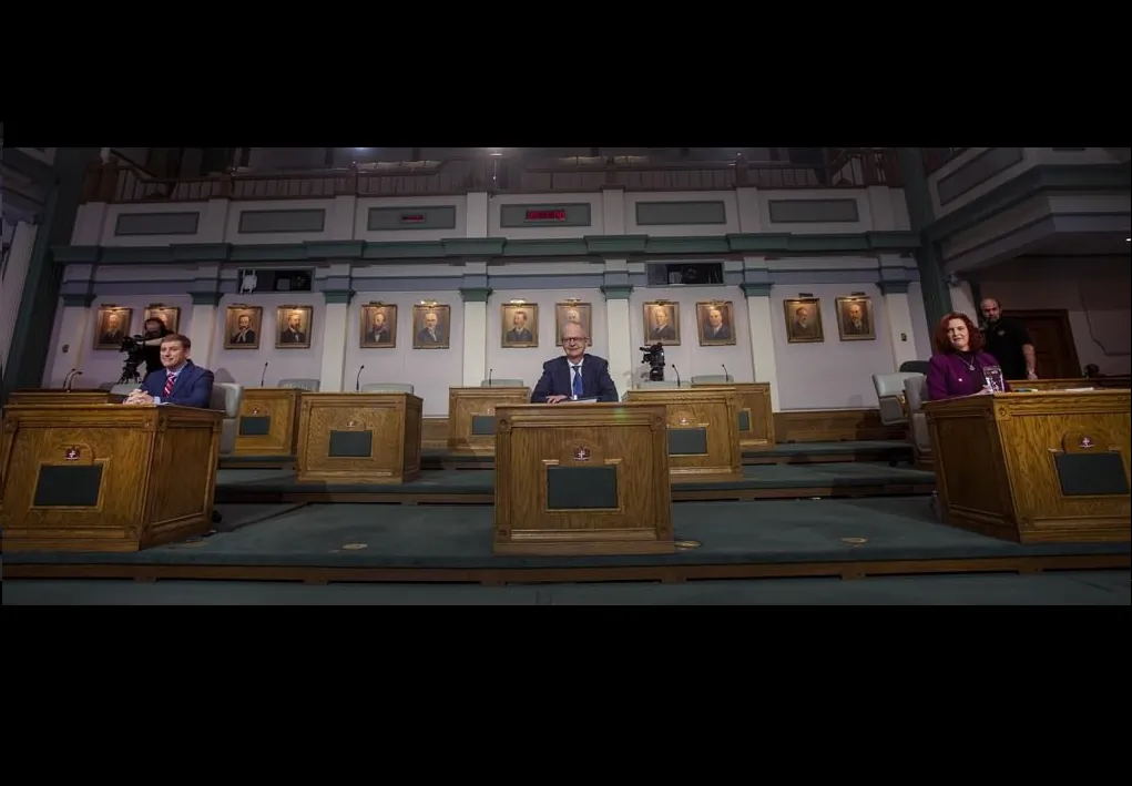 (L-R) Liberal Leader Andrew Furey, Progressive Conservative Leader Ches Crosbie, and NDP Leader Alison Coffin sit prior to the start of their televised debate from the floor of the House of Assembly in St. John's N.L. on Feb. 3, 2021. (The Canadian Press/Paul Daly) 