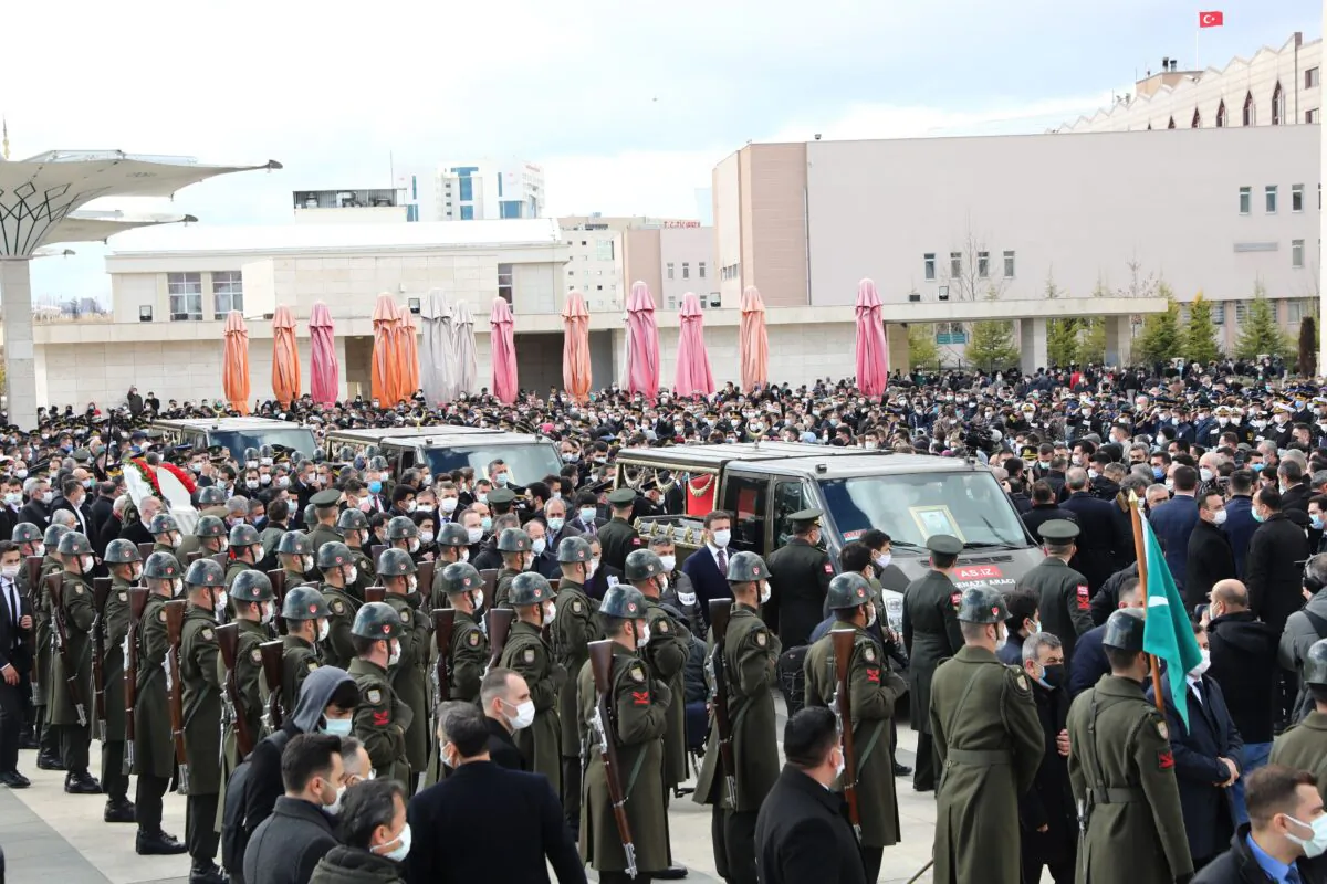 The coffins of three Turkish military personnel killed in action arrive in military vehicles at the Ahmet Hamdi Akseki Mosque during their funeral in Ankara on Feb. 12, 2021. (Adem Altan/AFP via Getty Images)