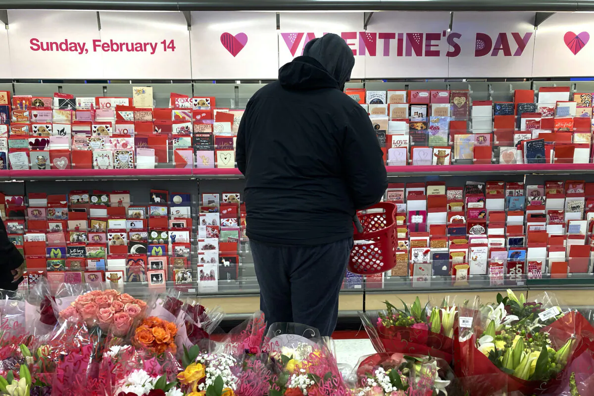 A shopper looks over Valentine's Day cards at a Chicago area store on Feb. 13, 2021. (Charles Rex Arbogast/AP)