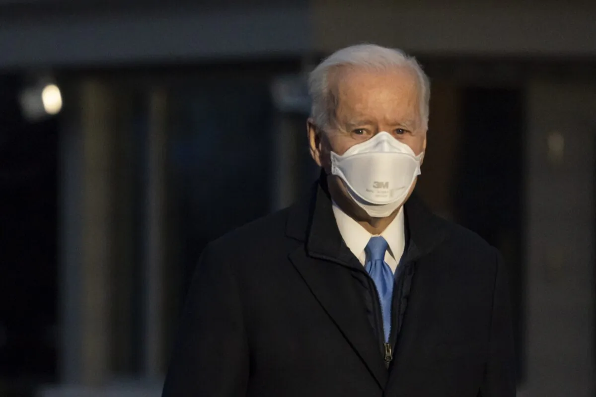 President Joe Biden pauses to speak with reporters as he walks to Marine One for departure from the South Lawn of the White House in Washington on Feb. 12, 2021. (Alex Brandon/AP Photo)