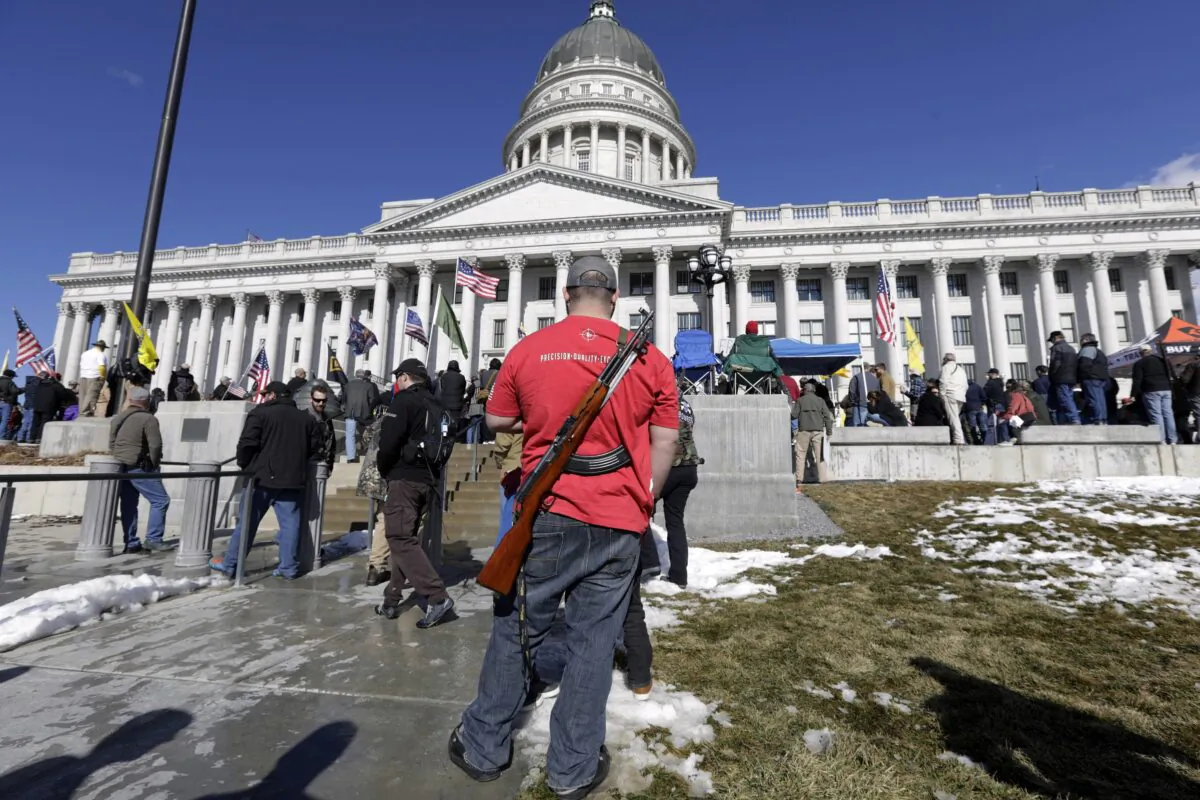 A man carries his weapon during a pro-Second Amendment rally at the Utah State Capitol in Salt Lake City on Feb. 8, 2020. (Rick Bowmer/AP Photo)
