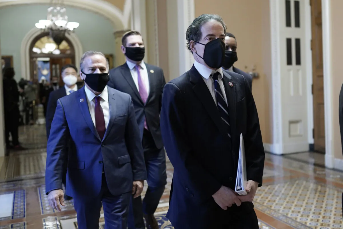Democratic House impeachment managers, led by Rep. Jamie Raskin (D-Md.) walk out of the Senate Chamber in the Capitol after former President Donald Trump was acquitted by the Senate, in Washington on Feb. 13, 2021. (J. Scott Applewhite/AP Photo)