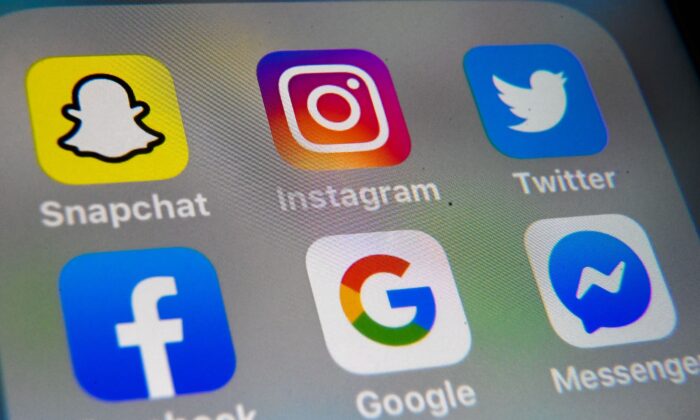 Logos of the Big Tech giants are displayed on a tablet on Oct. 1, 2019. (Denis Charlet/AFP via Getty Images)