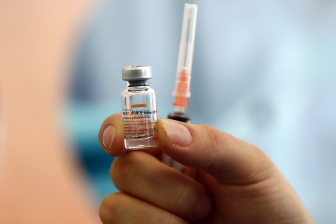 A health worker shows a dose of CoronaVac vaccine during a COVID-19 vaccination campaign in Ankara, Turkey, on Jan. 27, 2021. (Adem Altan/AFP via Getty Images)