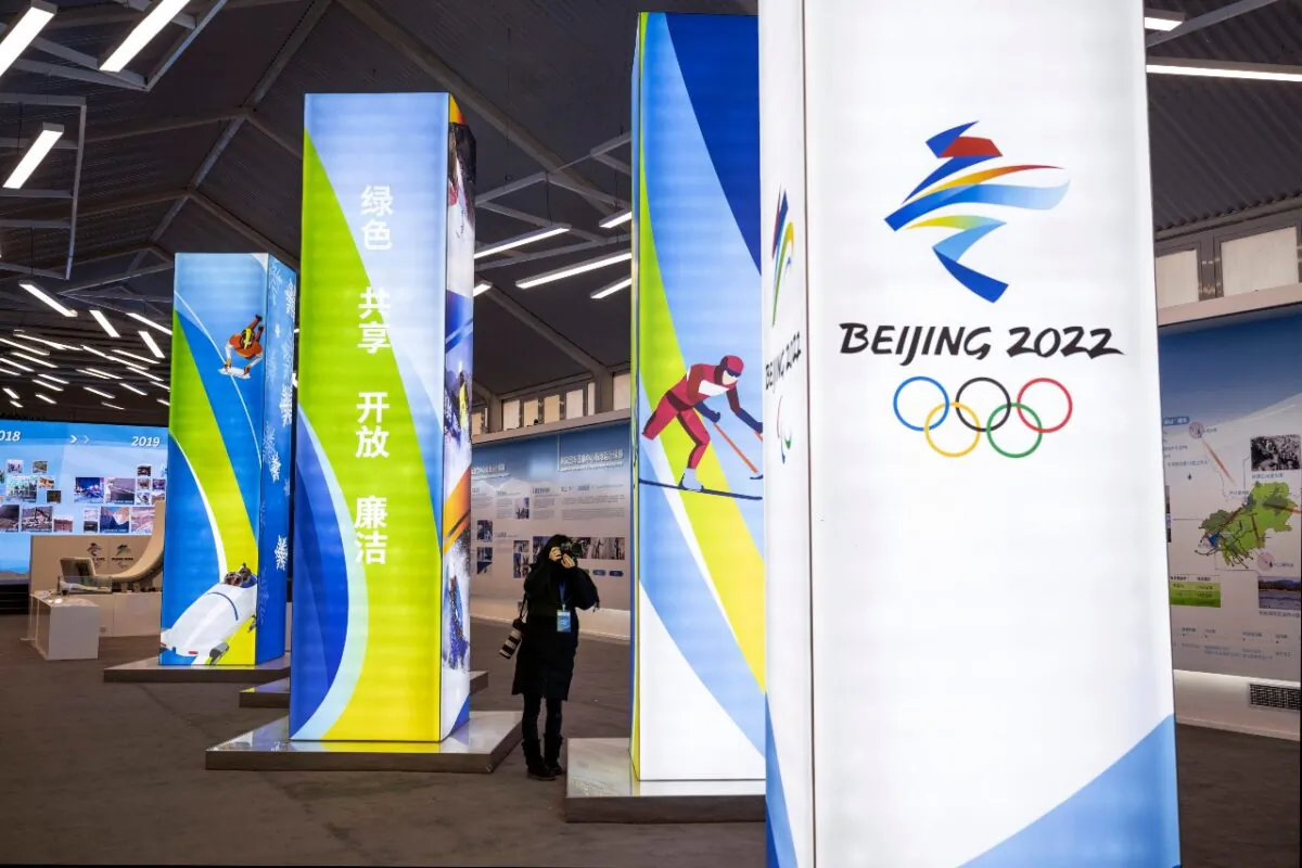 A journalist takes pictures of a display at the exhibition center for the Beijing 2022 Winter Olympics in Yaqing district on in Beijing, China, on Feb. 5, 2021. (Kevin Frayer/Getty Images)