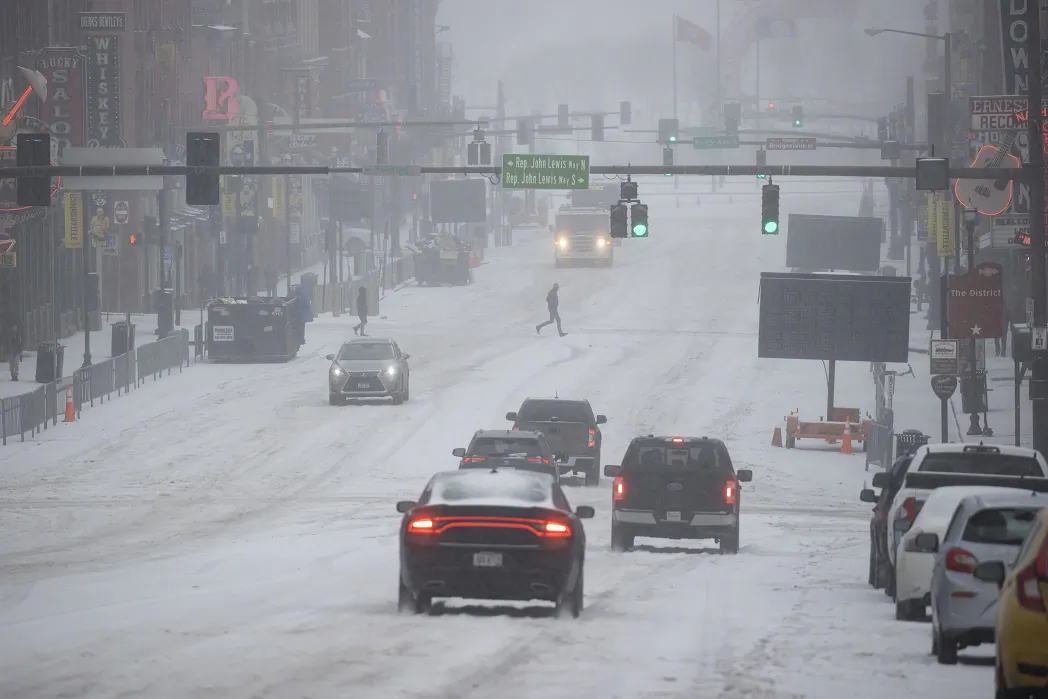 General view of Lower Broadway as vehicles and people traverse through snow and ice in Nashville, Tenn., on Feb. 15, 2021. (Brett Carlsen/Getty Images)