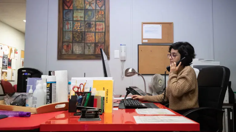Crisis line volunteer Shoak Alhussami at Battered Women's Support Services in Vancouver. (Darryl Dyck/The Canadian Press)