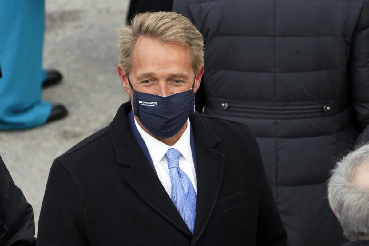 Former Sen. Jeff Flake (R-Ariz.) arrives for the inauguration of President Joe Biden at the U.S. Capitol in Washington on Jan. 20, 2021. (Andrew Harnik/AP Photo)