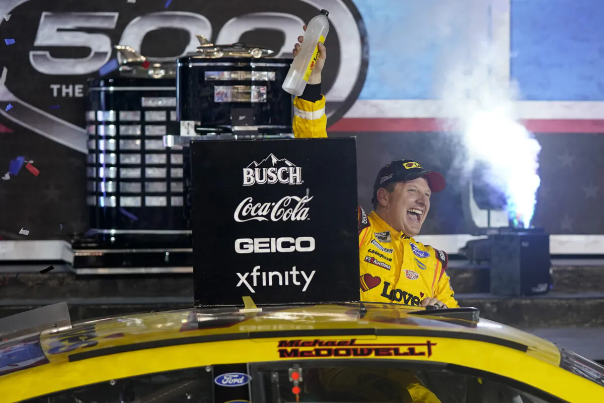 Michael McDowell celebrates after winning the NASCAR Daytona 500 auto race at Daytona International Speedway, in Daytona Beach, Fla., on Feb. 15, 2021. (John Raoux/AP Photo)