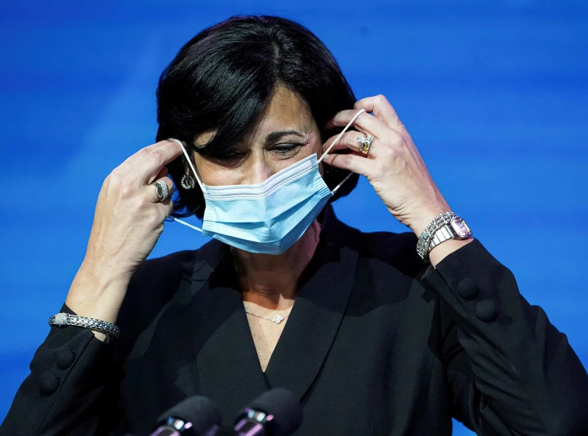 Dr. Rochelle Walensky, now the director of the Centers for Disease Control and Prevention, removes her mask to speak during a news conference in Wilmington, Del., on Dec. 8, 2020. (Kevin Lamarque/Reuters)