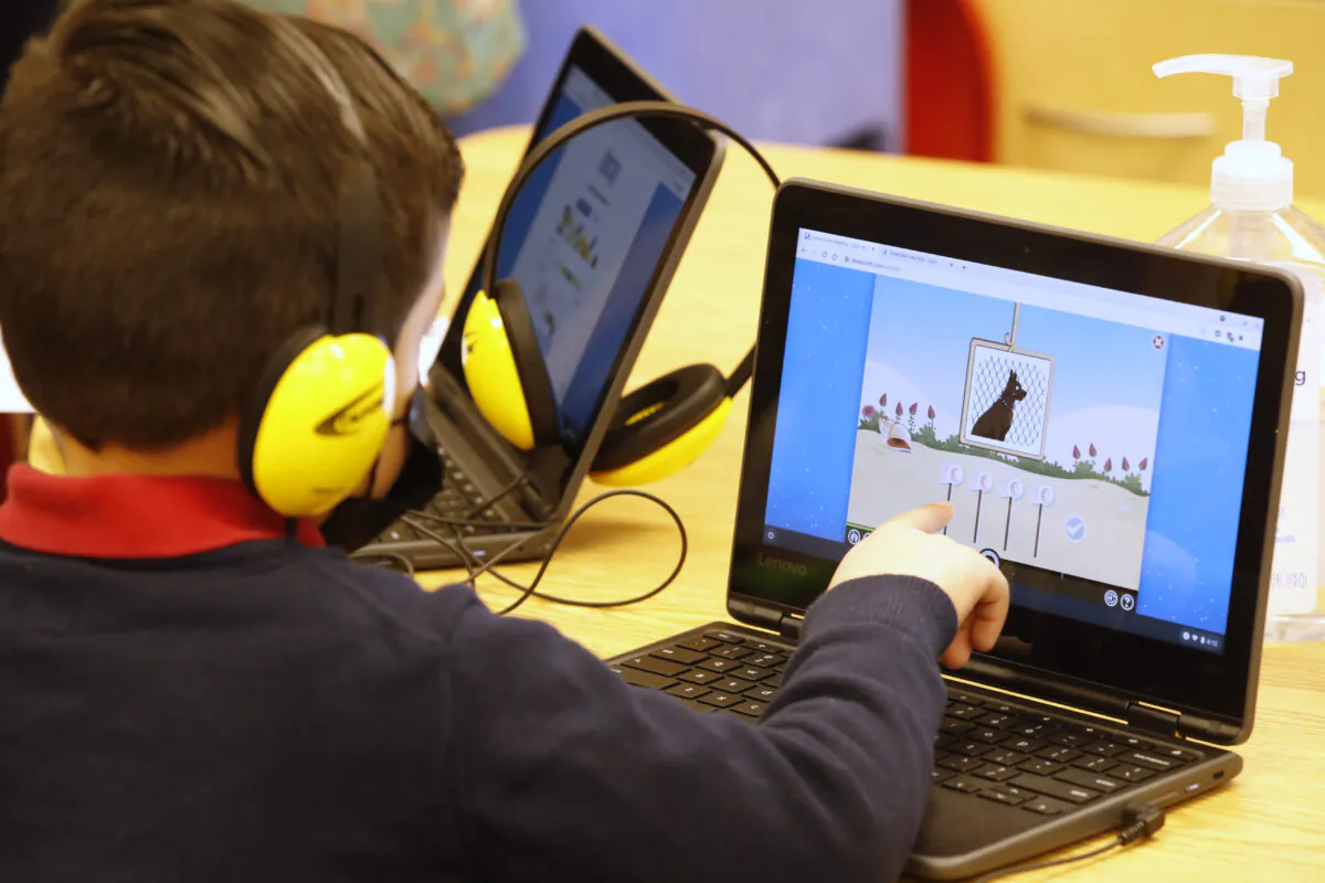 A student works on a computer at Freedom Preparatory Academy in Prove, Utah, on Feb. 10, 2021. (George Frey/Getty Images)
